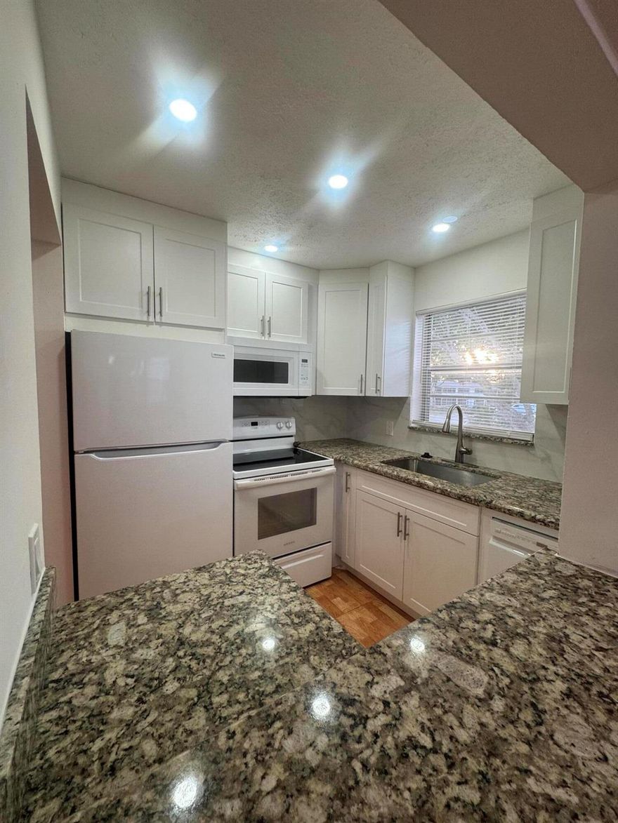 Live your Luxury in Sunny South Florida with this Rarely Available Gem of a Corner Unit Condo. Nestled within Century Village, An Amazing Opportunity Awaits in this Pleasantly Relaxing 55+ Community. Tastefully Renovated this Corner Condo Features 1 Bedroom / 1 Bath / and a 1/2 Bath. Upon Arrival you'll Find an Assigned Parking only Steps from your Front Door. One of the few Condos With Central A/C! Entering the Condo you're met with Aesthetically Pleasing Tile Flooring, A Newer Kitchen, and Tiled Bathrooms. Delightfully Located minutes from Restaurants, & Shopping. Capitalize on this Opportune Moment and Enjoy the Many Amenities Offered within the Community. Schedule your Private Showing Today!