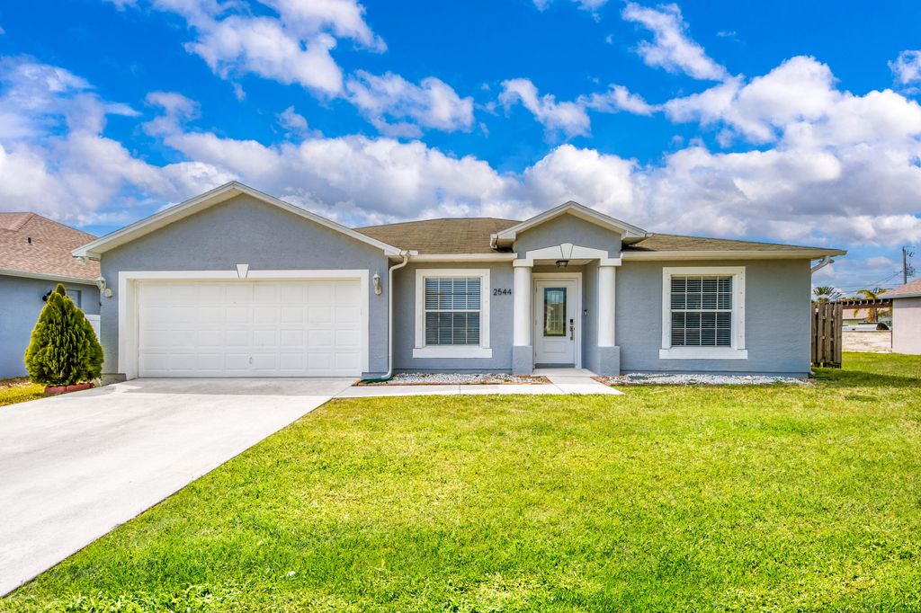 Photo of 2544 SW Deckard Street, Port Saint Lucie, FL 34953 (MLS # B26008143)
