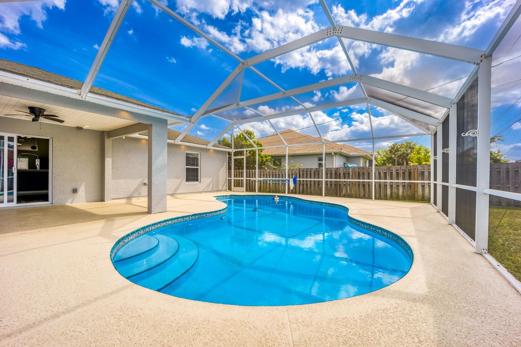 Photo of 2544 SW Deckard Street, Port Saint Lucie, FL 34953 (MLS # B26008143)