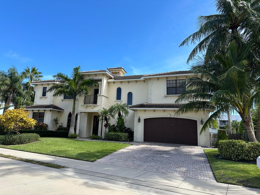 Enjoy 100 feet of prime canal frontage with coveted southern exposure in this rare and spacious, 5 bedroom, 4 bath waterfront home. Boating enthusiasts will appreciate the 9,000 lb. lift, large dock, and easy access to the ocean via the Palm Beach Inlet. High ceilings, light-filled rooms, and an open floor plan create a bright, airy atmosphere. Features include a wood-burning fireplace, impact windows and sliders, and an inviting pool with expansive covered patio- perfect for entertaining. The spacious upstairs lanai is ideal for relaxing in private. Yacht Harbor Manor is a quiet neighborhood and just a short walk to Singer Island's pristine beaches, minutes from the Sailfish Marina, top dining, shopping, Palm Beach, West Palm Beach, and Palm Beach