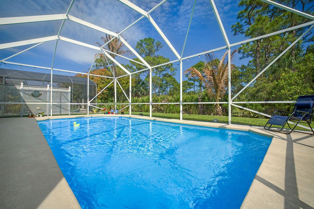 Photo of 7004 SE Twin Oaks Circle, Stuart, FL 34997 (MLS # B26008197)