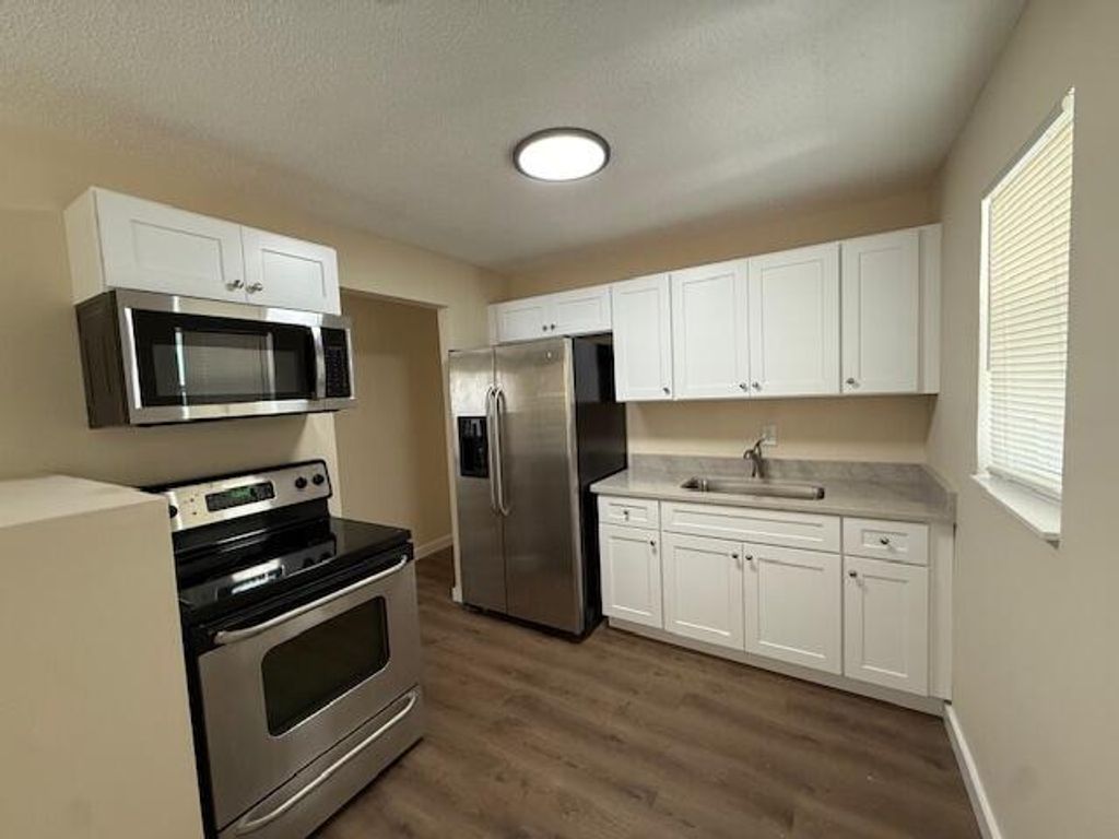 Photo of 1511 W 12th Street, Riviera Beach, FL 33404 (MLS # B26020572)