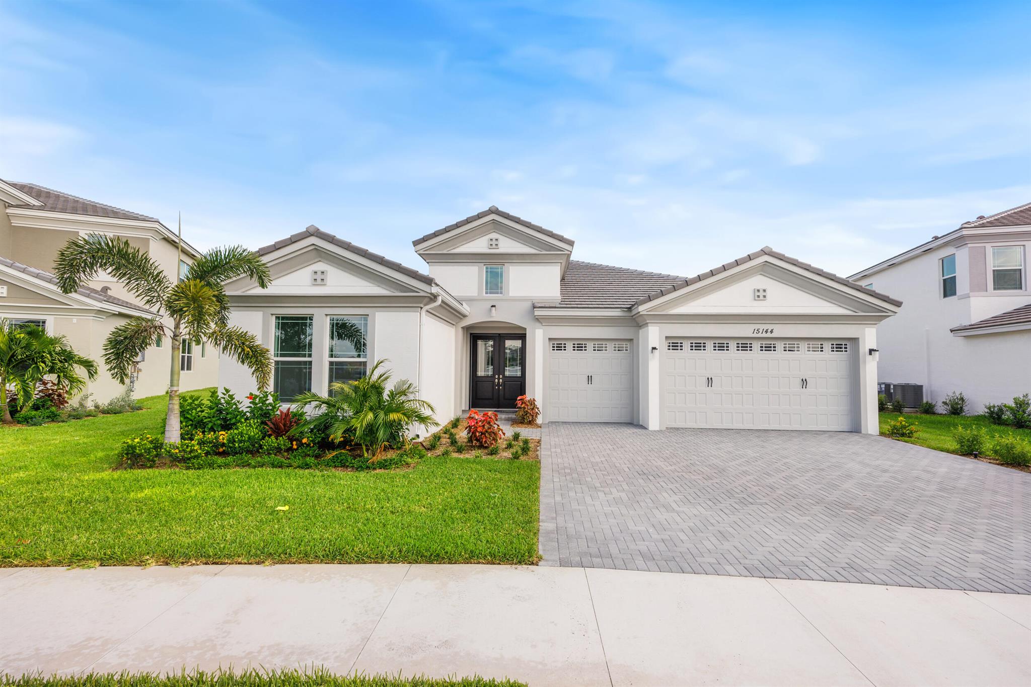 Welcome to your dream home! This brand-new, never-lived-in Sanderling model in Westlake, Florida is where luxury, comfort, and style meet--without the wait. No need to spend months building--this stunning home is already complete and ready for you. With 5 bedrooms, 4 bathrooms, and a spacious 3-car garage, this single-story masterpiece offers a thoughtful, open layout perfect for both everyday living and grand entertaining.As you arrive at the quiet cul-de-sac, you'll immediately notice the oversized pie-shaped lot--a rare find--perfectly positioned to offer stunning water views from every angle with no rear neighbors in sight. Step inside and be greeted by soaring ceilings, abundant natural light, and gorgeous tile flooring throughout that adds elegance to every step.