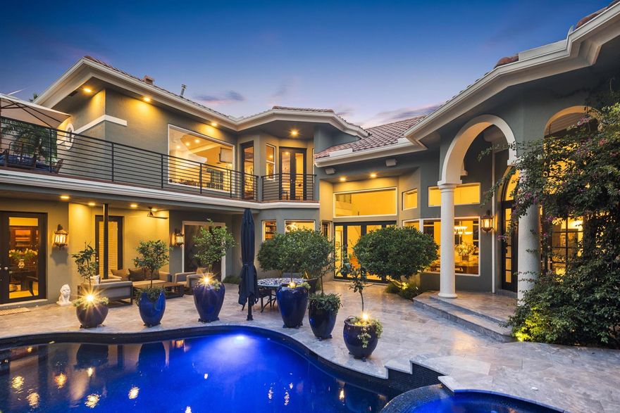 Beautifully renovated custom modern lakefront home with endless amenities. Featuring 4 bedrooms, 4 full baths, powder room, library, and guest house. Inviting waterfront living room with fireplace. Open concept with chef's kitchen, living room, and dining room. Soaring ceilings, full house generator, water filtration system, and 2 balconies overlooking pool. Fabulous tropical courtyard area surrounding pool and spa. Waterfront patio features beautiful marble BBQ. Excellent Seasons neighborhood features resort-style pool, fitness center, playground, tennis courts, basketball courts, and more.