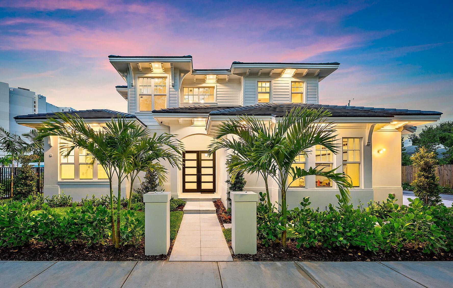 Welcome to 295 Austin Lane, a picturesque new build designed by architect Kelly Yates, this West Indies inspired coastal modern residence captures the spirit of the Mango Promenade Historic District, marrying timeless architecture with a sophisticated yet welcoming aesthetic. With four bedrooms and four and a half bathrooms, highlights include elevated finishes, handsome engineered hardwood flooring, impact-rated windows and doors, and high ceilings with inset lighting. In a light-filled open floor plan expertly executed for today's Florida living, the great room features a custom wet-bar and a wall of sliding doors that open to the pool-view patio.