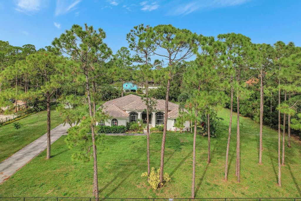 Photo of 17315 Key Lime Boulevard, Loxahatchee, FL 33470 (MLS # R10943021)