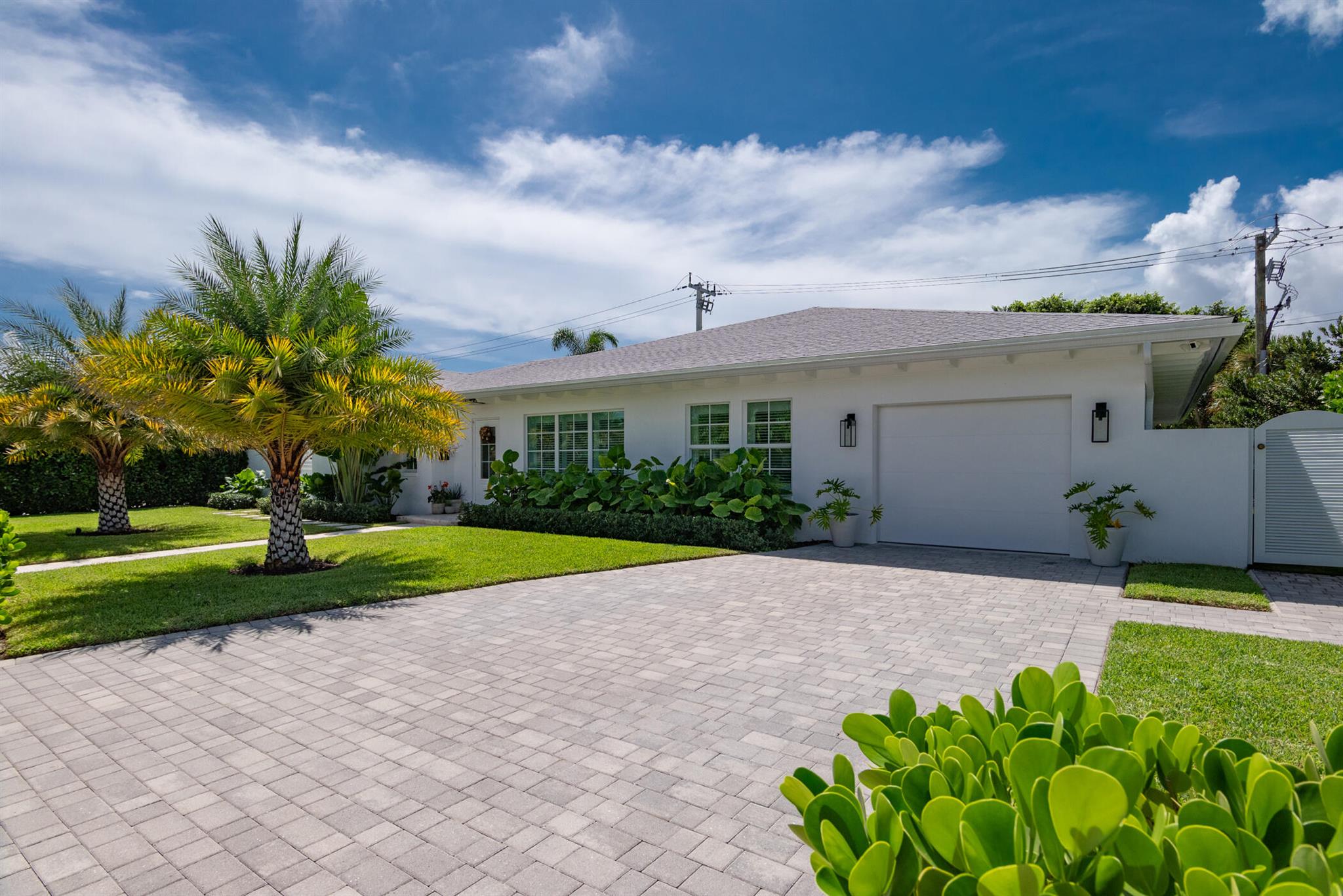 Welcome to 376 Lytle Street, a gorgeous single family home nestled in sought-after SoSo neighborhood of West Palm Beach. Built in 2022, this one story home offer a spacious layout, a modern kitchen, and seamlessly blends comfort and style. This 4 bedroom 4 bathroom plus bonus room offers a combination of privacy and family living. Bedrooms are nicely separated to give each family member privacy. Bonus room can be used as an office, mother-in-law, or den. This home features high quality finishes throughout which include a gourmet kitchen, spa inspired master bedroom/bathroom suite, elegant custom cabinets in the baths and kitchen, impact windows and doors providing natural light & security. Tile throughout and walk-in-closets in the bedrooms. Family room overlooks pool and patio area.