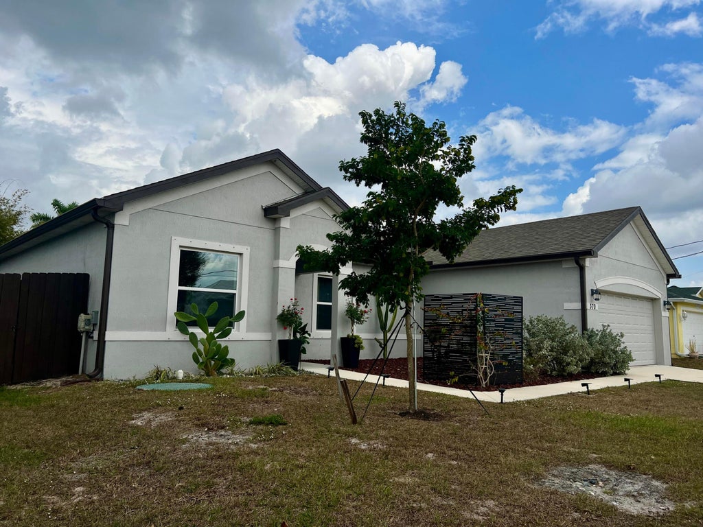 Photo of 370 SW Kestor Drive, Port Saint Lucie, FL 34953 (MLS # R11158060)