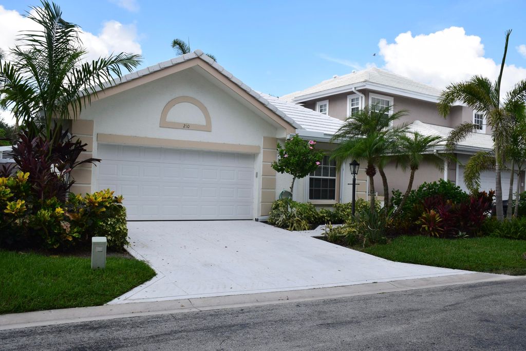 Photo of 210 Canterbury Drive W, Palm Beach Gardens, FL 33418 (MLS # R11107016)