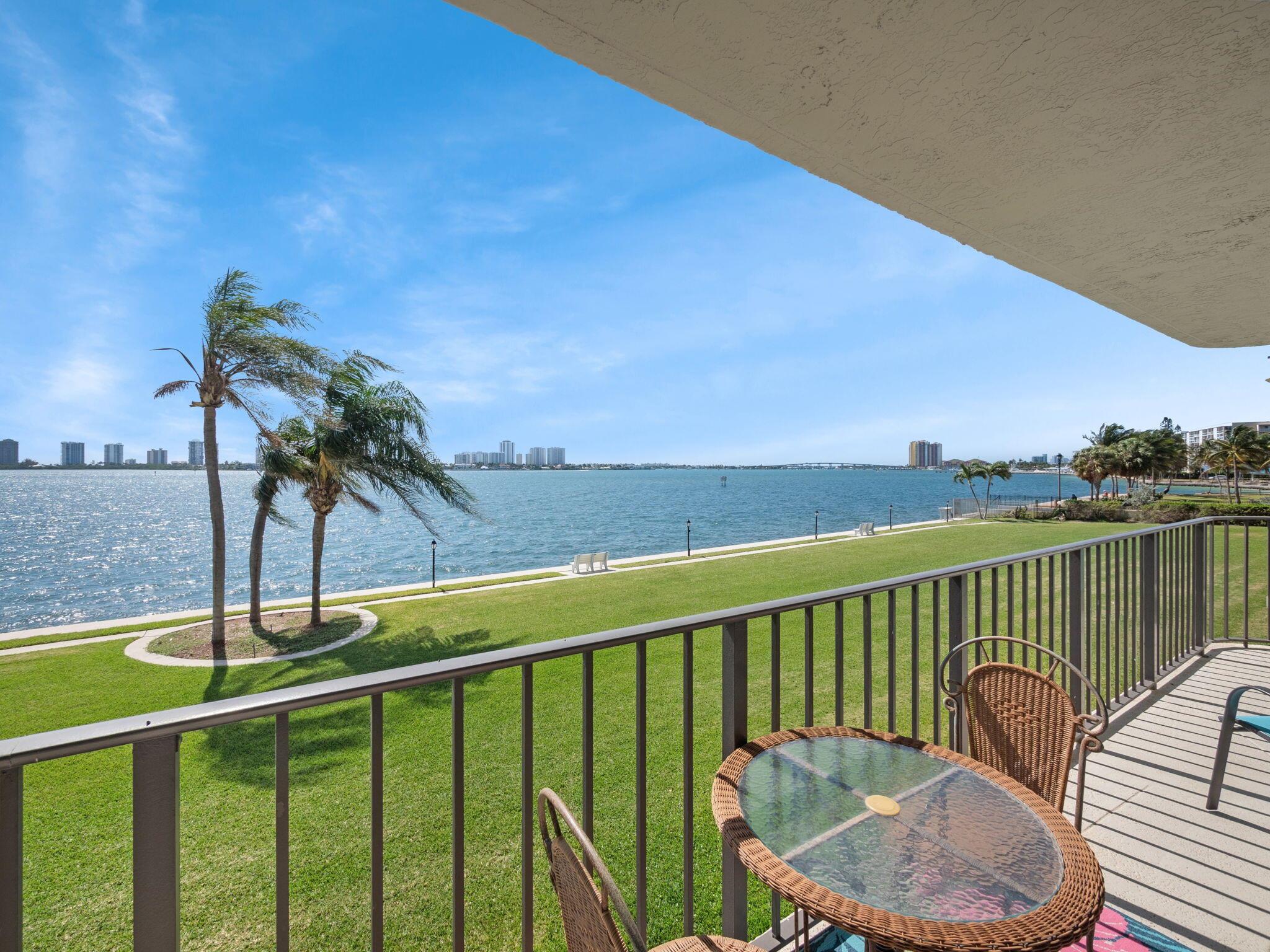 Walk into the most amazing water views looking over Singer Island skyline. This slice of paradise will give you amazing glistening sunrises and cool evenings on the open balcony. Well maintained, second owner condo with split 2 bed/2bath, spacious living space and interior laundry. All freshly painted, brand new AC and hot water heater. Gated entrance with assigned covered parking with evolving areas of multi-million-dollar condos. Amenities include 2 pools, BBQ area, putting green, shuffle board, social room all adjacent to Kelsey Park with pickle ball and tennis. Conveniently located just moments away from downtown West Palm, short walking or driving distance to shopping and restaurants, 10 minutes from beaches and 20 minutes to PBIA. Resort style living.