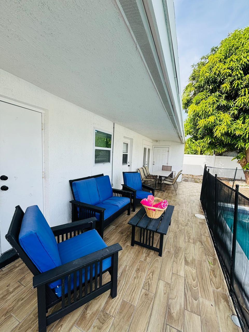 Welcome to your dream home in Pompano Beach! This spacious 4-bedroom, 3-bathroom residence also features a convenient poolside bath, perfect for indoor-outdoor living. Step outside to a private backyard oasis with a sparkling pool, comfortable seating, and a large porch surrounded by mango and palm trees, beautifully lit for evening relaxation. Inside, enjoy a fully equipped kitchen, open living areas, and an entertainment space with a pool table. Bedrooms are generously sized, offering comfort for family and guests alike. Located close to the beach, top restaurants, and major shopping centers, this home combines convenience, comfort, and fun. Ideal as a primary residence, vacation escape, or investment opportunity--don't miss it!