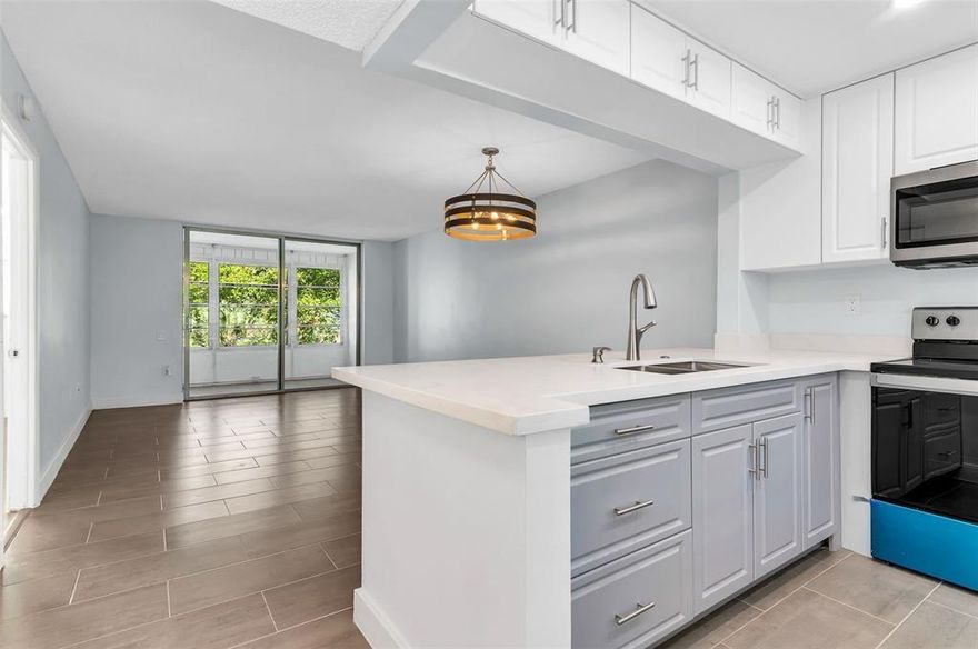 Fully remodeled 1-bedroom, 1-bath condo in the sought-after 55+ Lime Bay community; move-in ready and waiting for you! This spacious unit offers an open layout, large primary bedroom and bath, extra storage, and a screened balcony. Lime Bay offers endless fun with shows, bingo, movies, karaoke, Sunday BBQs, pickleball, paint stick bingo, bocce, and holiday events. Enjoy 3 pools and a hot tub, card room, tennis, shuffleboard, billiard room, library, gym, and so much more. Laundry facilities and elevator on-site. Conveniently located near golf courses, shopping, dining, and major transportation.
