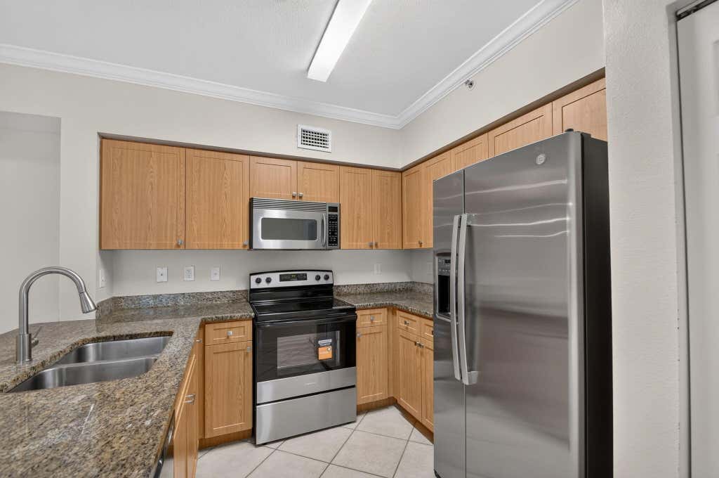 Photo of 6370 EMERALD DUNES Drive #203, West Palm Beach, FL 33411 (MLS # B26066913)
