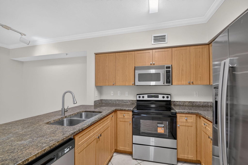 Photo of 6370 EMERALD DUNES Drive #203, West Palm Beach, FL 33411 (MLS # B26066913)