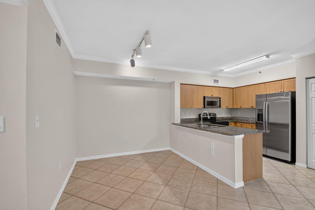 Photo of 6370 EMERALD DUNES Drive #203, West Palm Beach, FL 33411 (MLS # B26066913)
