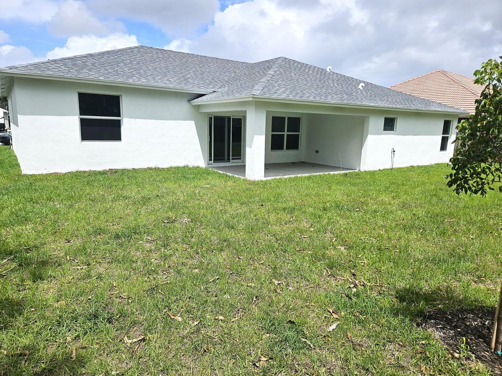 Photo of 758 SW Mccoy Avenue, Port Saint Lucie, FL 34953 (MLS # B26015544)