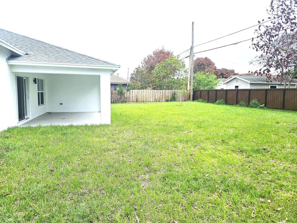 Photo of 758 SW Mccoy Avenue, Port Saint Lucie, FL 34953 (MLS # B26015544)