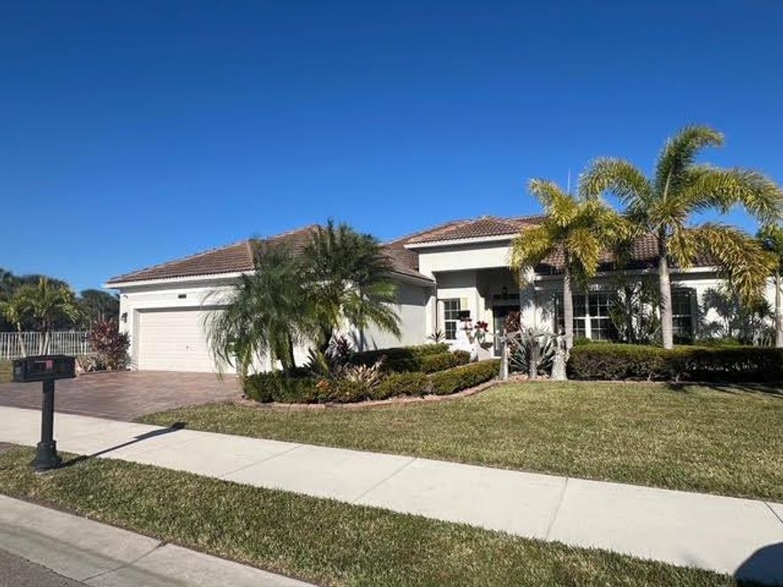 All the Bells and Whistles !
This 4 Bedroom 3 Bath 3 Car Garage Beauty has it all. Large Inground Pool and Spa is Screened and Heated, perfect for Relaxing and entertaining along with the oversize Covered Porch Area as well. Luxurious Master Bedroom Suite features Double Sinks, Separate Roman Tub and Shower. Formal Living Room and Dining Room, Plus Huge Open Concept Family Room adjacent to Gourmet Kitchen. Split Bedroom Plan, 4th bedroom has private access to Cabana Bath, Porch and Pool enclosure. Oversized Corner Lot adjacent to a Tranquil Lake and Fountain. Located in the Very Desirable Estates of Tradition and minutes away from all the downtown Tradition Shopping, Restaurants, Medical Facilities, Recreational Facilities, Parks and Community Events. New on Market and Priced to Sell !