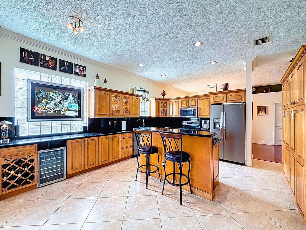 Photo of 5985 NW 72nd Court, Parkland, FL 33067 (MLS # F10508625)