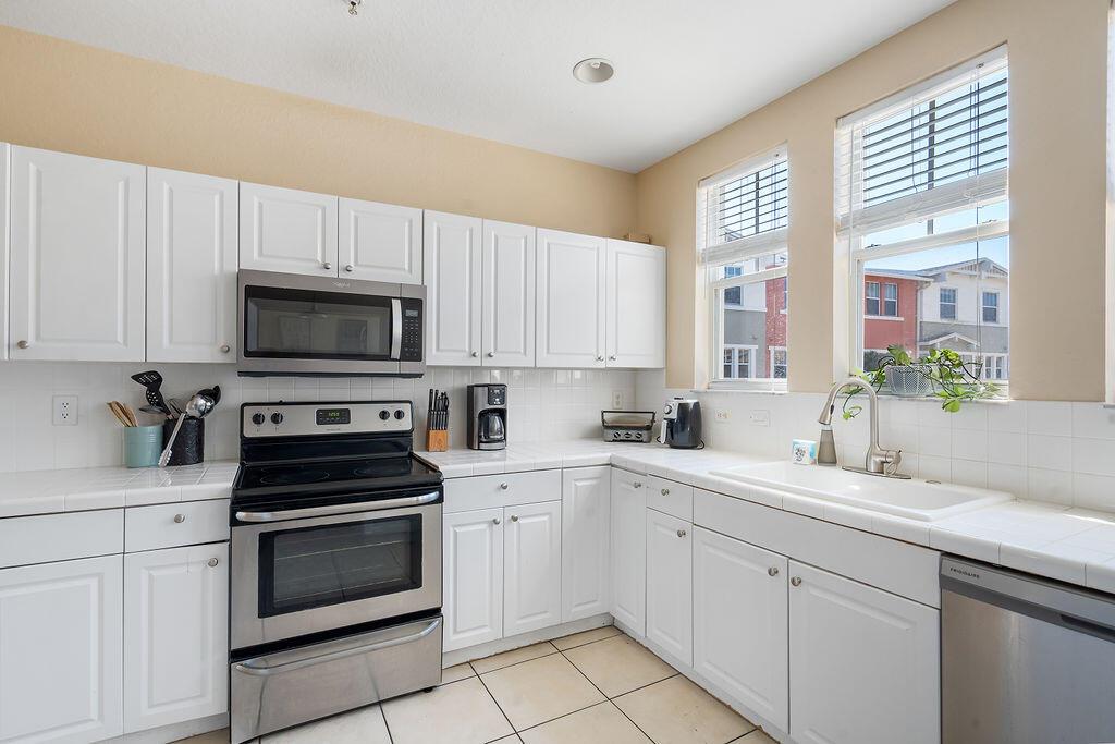 HUGE 4 BR, 3.5 BA townhouse w/ 2 car garage, luxury vinyl throughout. Rent includes basic cable, internet, water, impact windows, manned gate. Washer/dryer, resort-style pool, clubhouse, fitness room. Close to everything, shopping, dining, downtown, airport, nightlife, etc. Pets ok with deposit. Property professionally managed. Tenant must carry renters & liability insurance. RentSpree req'd (broker may provide, no free reports) App fees $100 to CitySide (per adult, married counts as one). NOTE: CITYSIDE HOA application is done online - citysideonline First & TWO MONTHS security required. Per HOA rules no more than 4 unrelated persons to occupy unit. Rent to be paid VIA Zelle.