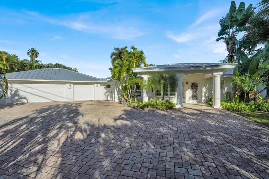 Located in Palm Beach Gardens, this spacious 5BR/4.5BA home with a flex room and 3-car garage sits on a .49-acre lot with 55' of canal frontage, and direct access to the Intracoastal with no fixed bridges--ideal as a primary residence or investment property. The cabana building offers a sauna and half bath. No HOA fees. Close to beaches, shopping, fishing, golf, parks, medical services, and minutes to PBI. Updates include:  pool pump/filter 2025, metal roof 2023, new flooring 2023, kitchen 2023, and new insulation 2023.