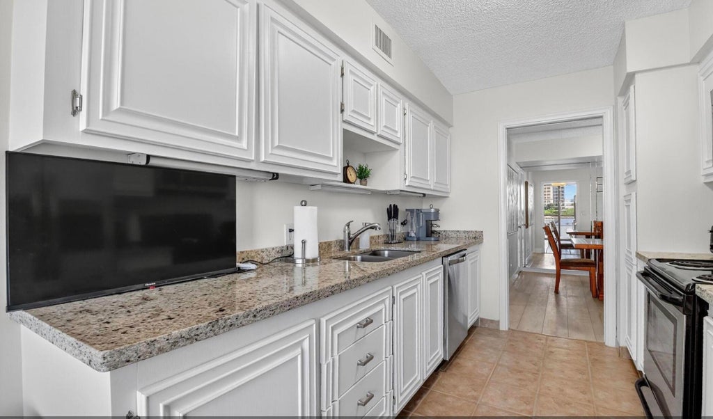 Photo of 3400 N Ocean Drive #405, Singer Island, FL 33404 (MLS # B26038188)