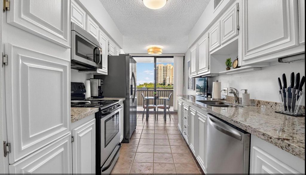 Photo of 3400 N Ocean Drive #405, Singer Island, FL 33404 (MLS # B26038188)