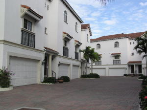 Enjoy living in this corner townhome with 3 brs and 3.5 baths, 2 car garage in a gated and secure community. Located at the Lands of the President within walking distance of the PB Outlets, Wholefoods, restaurants and shopping. State of the art open kitchen and closets galore. Two bedrooms are located on an upper floor and the third one is at ground level. Nearby is Kravis Center, City Place, downtown West Palm Beach, Palm Beach and beaches.