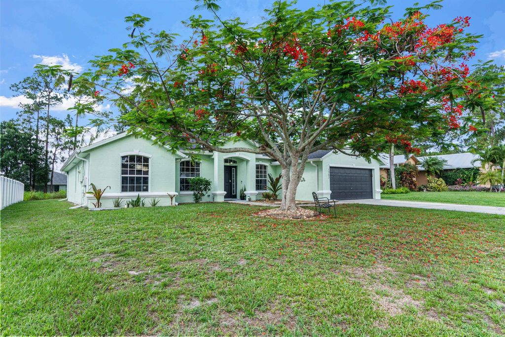 Photo of 1262 SW Hunnicut Avenue, Port Saint Lucie, FL 34953 (MLS # R11094445)