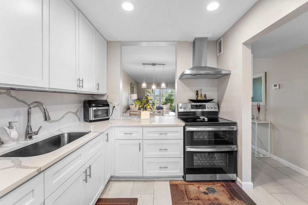 Photo of 112 Lake Constance Drive, West Palm Beach, FL 33411 (MLS # B26056690)