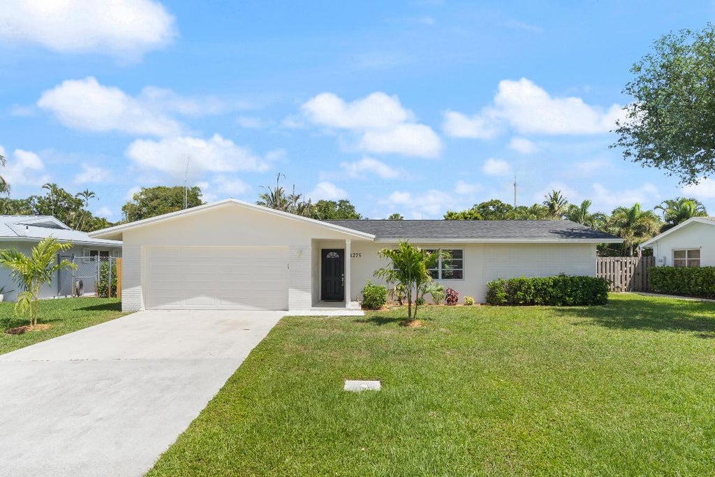 Photo of 4275 Honeysuckle Avenue, Palm Beach Gardens, FL 33410 (MLS # R11074686)