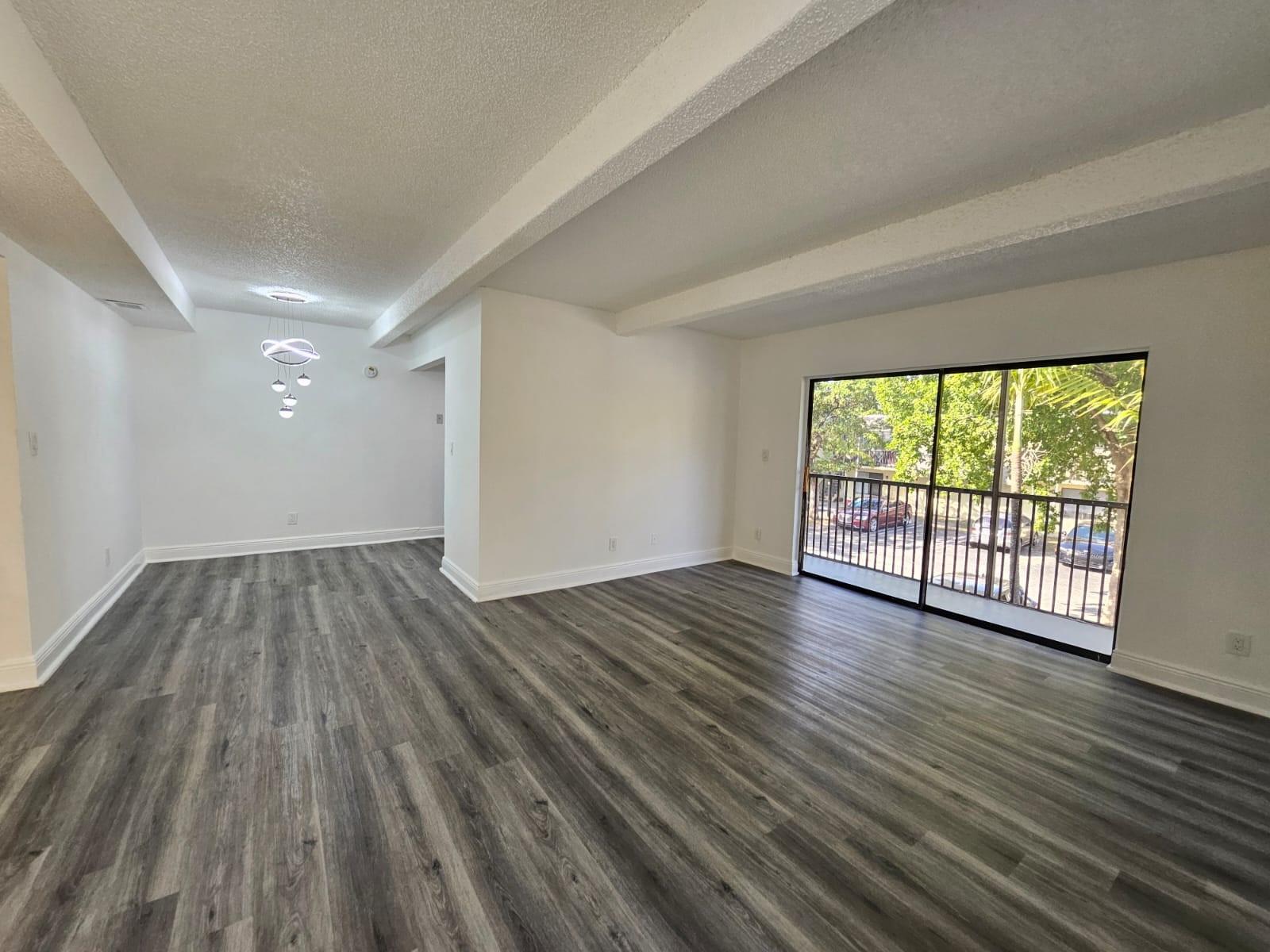 Discover your perfect coastal retreat in this charming second floor 900-square-foot apartment in the heart of Pompano Beach, FL. The inviting living space is adorned with sleek vinyl floors, creating a warm and welcoming atmosphere. Step into the heart of the home, where you'll find a stunning kitchen equipped with a brand-new stove, a microwave, a dishwasher, and elegant quartz countertops. Whether preparing a gourmet meal or enjoying a casual breakfast, this space will inspire culinary creativity. Located just five miles from the sparkling shores of Pompano Beach, this property offers easy access to sun, sand, and surf. With an efficient air conditioning system and included washer and dryer. Water included!