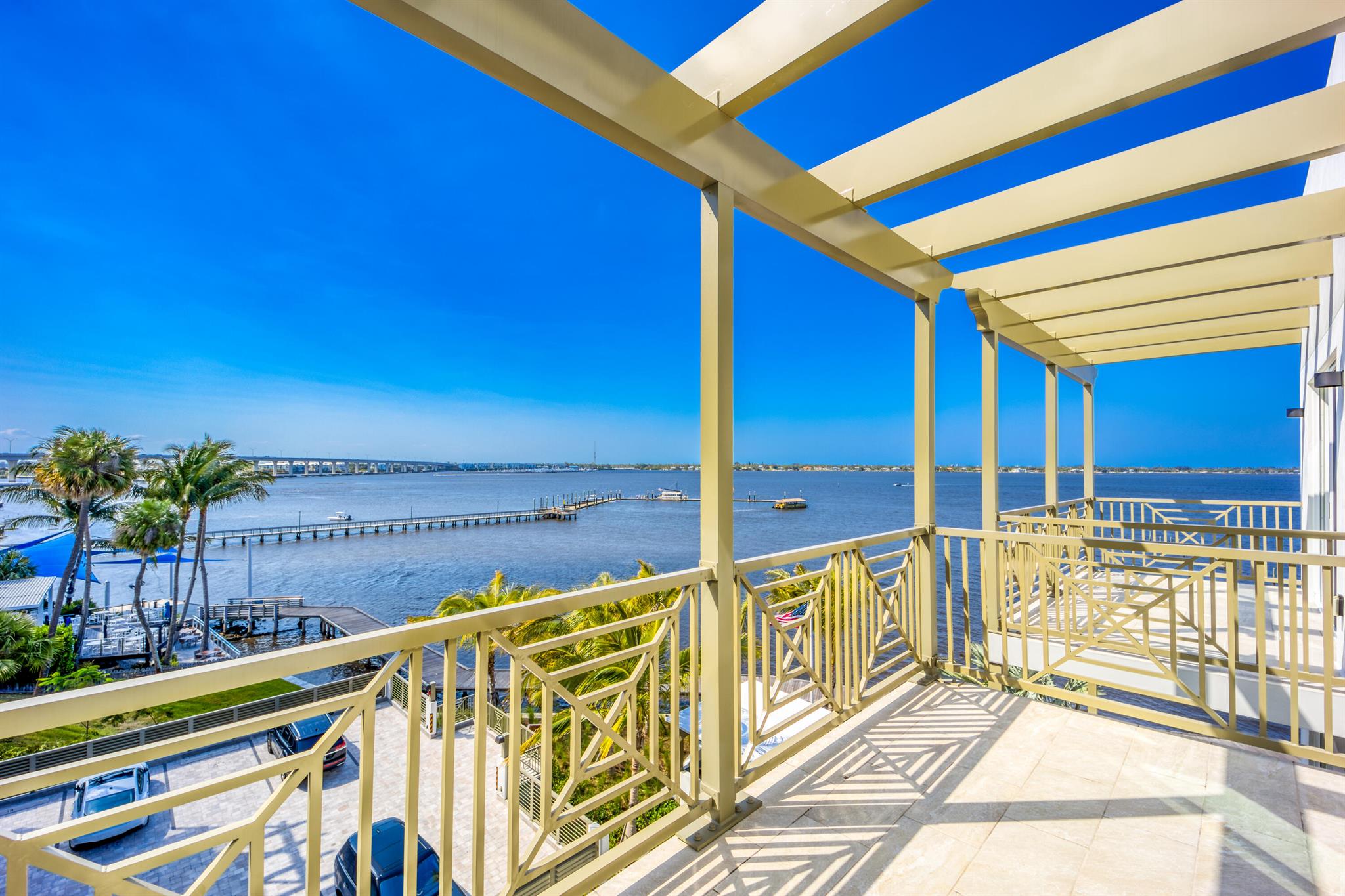 Experience luxury waterfront living at Sailfish Cove! This stunning 1BR/1BA condo showcases sweeping river views from your private balcony. Bright and open with impact windows, the home features a sleek chef's kitchen with granite counters and stainless steel appliances. The spacious primary suite offers serene water views, a walk-in closet, and a spa-inspired bath. Enjoy resort-style amenities including a heated pool, hot tub, summer kitchen, and rooftop deck with panoramic vistas. Gated entry, covered parking, and two elevators add convenience. Ideally located near vibrant downtown Stuart, beaches, dining, and shopping. Pet-friendly (1 small pet). Annual lease. Live the coastal dream with this direct riverfront unit!
