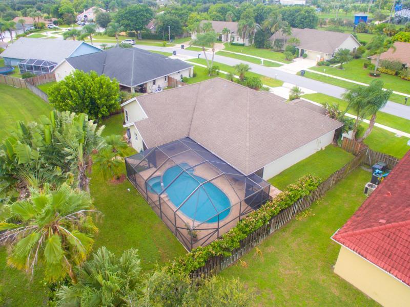 Spacious 4 bedroom 3 bath home in the heart of Wellington. Close to WEF, dining, shopping and schools. This home offers an ideal layout as there are 2 separate living rooms and dining spaces. Split floor plan and 3 full baths, one being a cabana. The covered lanai outside offers shade for when you want to cool off from the heat and the heated pool is ready when you want to take a swim all year round. The property is fully fenced lined with clusias and 6ft privacy. This is the perfect home for your off seasonal needs