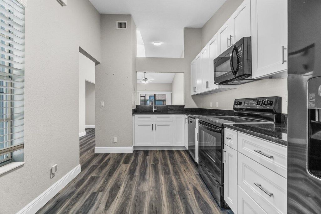 Photo of 3843 Island Club Circle Cir E, Lake Worth Beach, FL 33462 (MLS # R10816250)