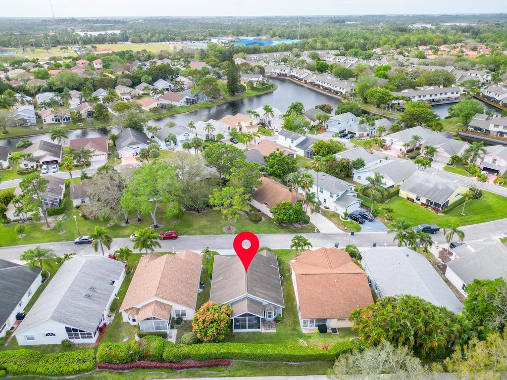 Photo of 129 Hammocks Drive, Greenacres, FL 33413 (MLS # R10966420)
