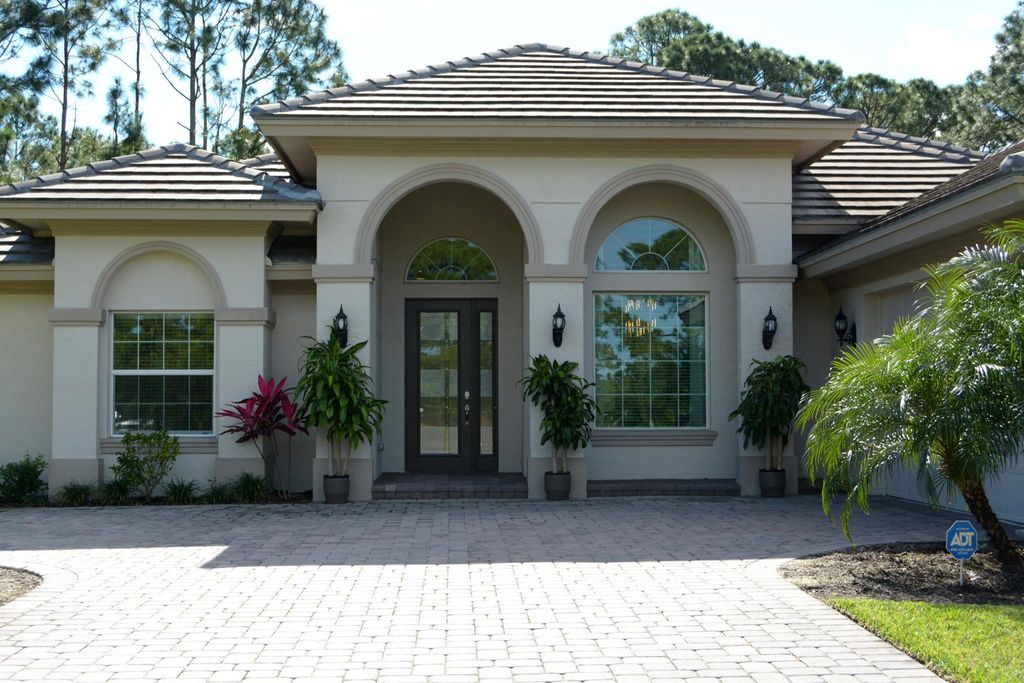 Photo of 9623 Knollwood Lane, Fort Pierce, FL 34951 (MLS # R10959568)