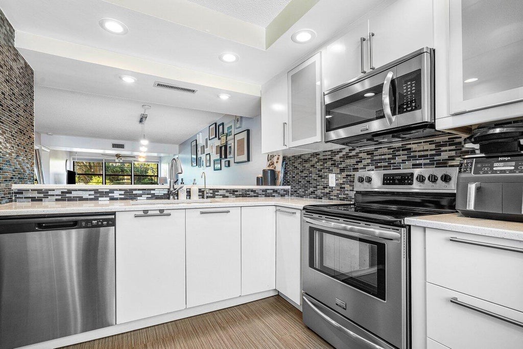 Photo of 6121 Balboa Circle #103, Boca Raton, FL 33433 (MLS # B26073551)