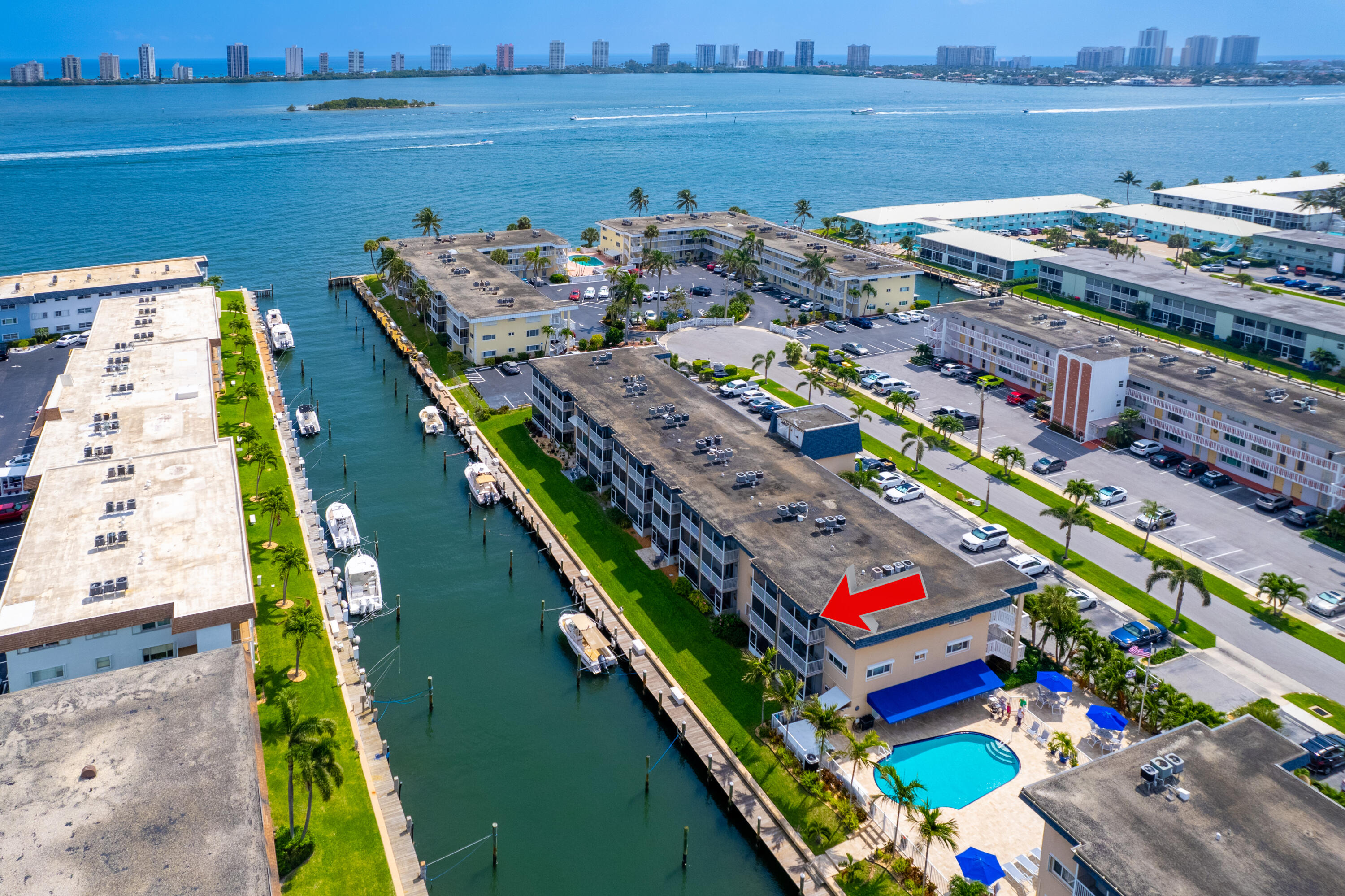 YOUR BOATERS PARADISE AWAITS for UNDER $200K!! This rare waterfront 2BR/2BA, 3rd floor end unit is a hidden gem in the active, 55+ waterfront boating community in North Palm Beach. If you own a boat or desire one, upon availability once an owner, you may lease a slip for only $1.50 per foot!! Features include; complete hurricane impact glass, fresh paint, 2017 AC, 2009 electrical panel, 2024 LG refrigerator, 2025 dishwasher & 2008 stove, 2018 water heater, Whirlpool microwave and ceramic tile flooring throughout. to You will enjoy the breathtaking morning sunrises and evening skyline views of Singer Island off your private balcony or poolside. In addition, you may rent unit after 2 years of ownership. You will LOVE the beautiful intracoastal breezes off your master bedroom screened