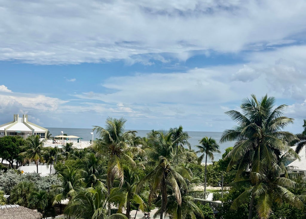 Photo of 305 BRINY Avenue #406, Pompano Beach, FL 33062 (MLS # B26064514)