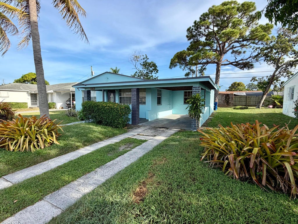 Photo of 1061 W 4TH Street, Riviera Beach, FL 33404 (MLS # B26067657)