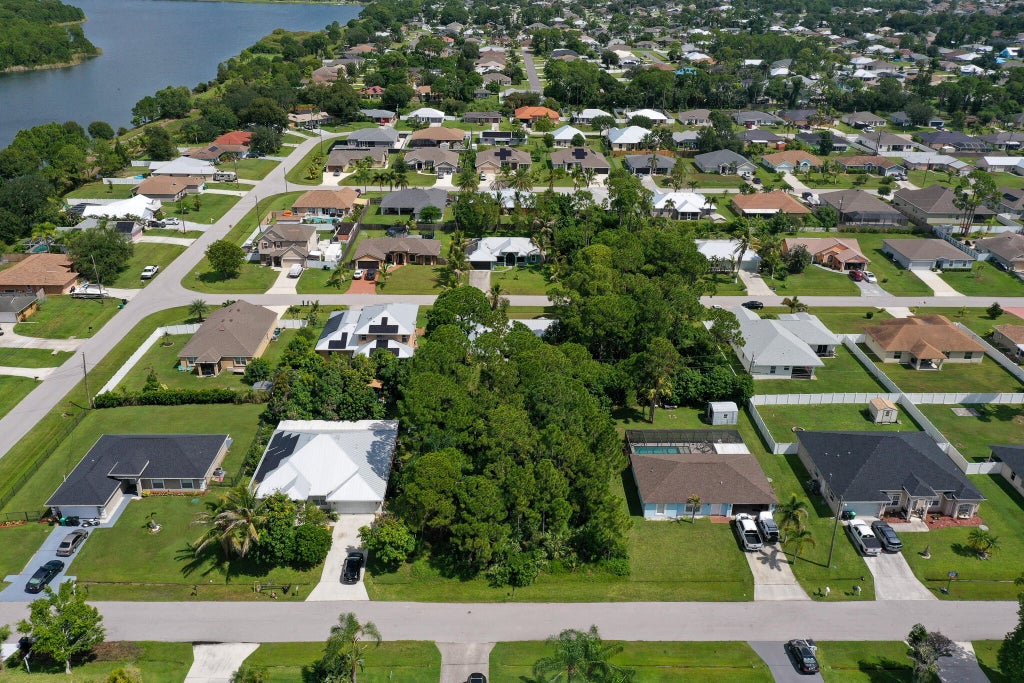 Photo of 1881 SW LOFGREN Avenue, Port Saint Lucie, FL 34953 (MLS # B26069552)