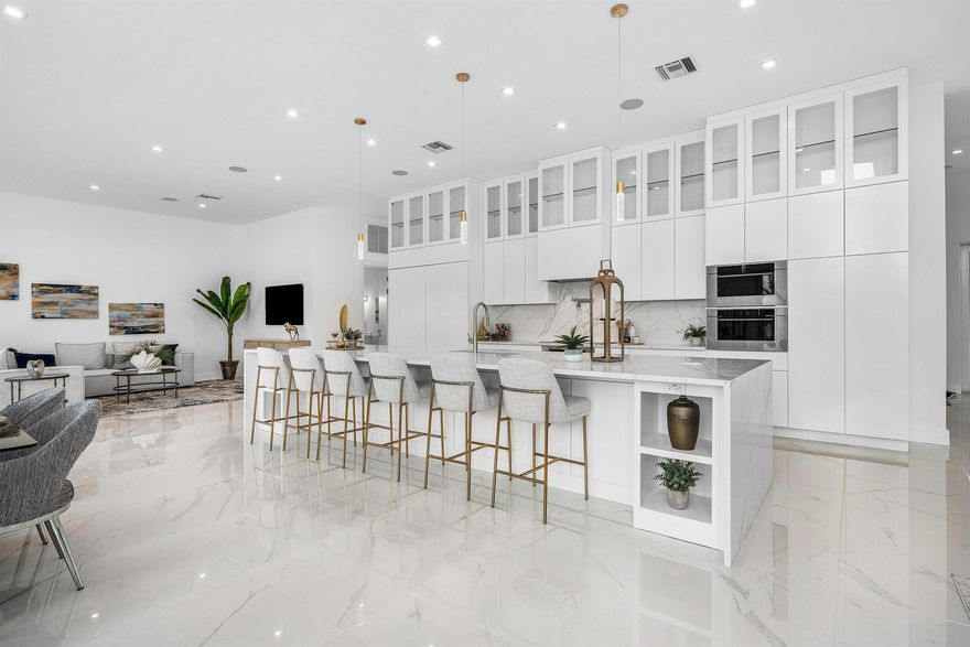 Experience luxury living at 2641 NE 48th Street, Lighthouse Point. Built by Abacus Construction of Miami, this new waterfront estate showcases block and steel construction, with both the residence and heated infinity-edge pool thoughtfully elevated on pilings for unmatched durability and stability. Enjoy a brand-new 80' dock with direct ocean access and no fixed bridges. Inside, soaring ceilings and floor-to-ceiling windows highlight open-concept living with breathtaking water views. The chef's kitchen is equipped with Wolf appliances, while 4 AC zones ensure comfort throughout. Outdoor living shines with a resort-style pool and an expansive patio designed for entertaining. A perfect blend of craftsmanship and modern elegance in a premier location just off the  Intracoastal.  A must see!