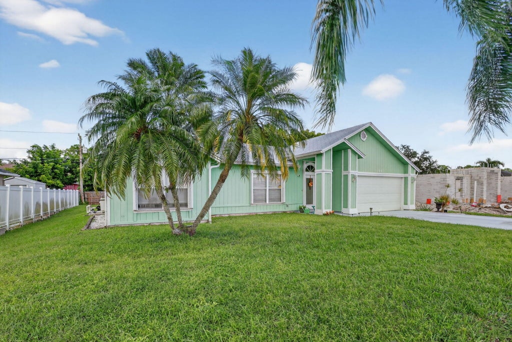 Photo of 1465 SW Dow Lane, Port Saint Lucie, FL 34953 (MLS # R11132765)