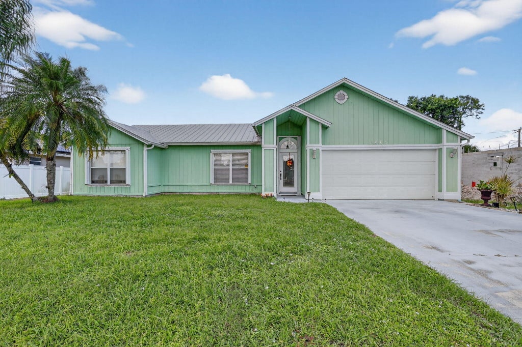 Photo of 1465 SW Dow Lane, Port Saint Lucie, FL 34953 (MLS # R11132765)