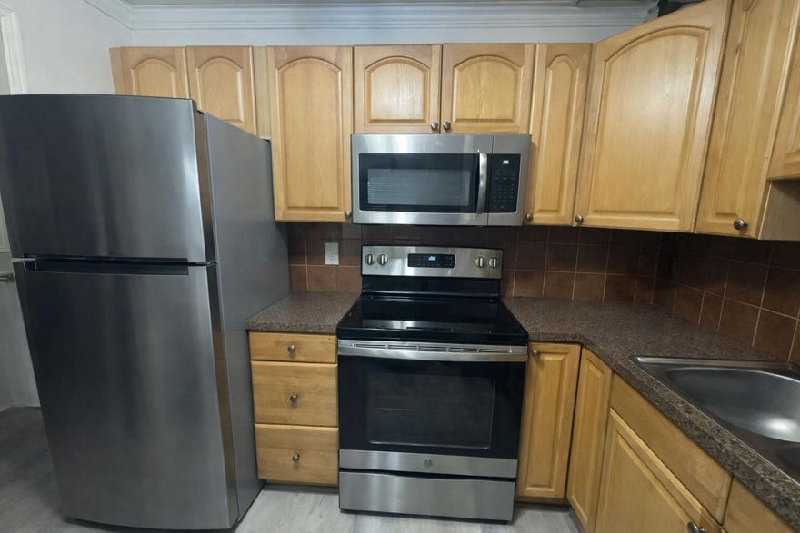 Resort-style living just 2 miles from beautiful Pompano Beach! This gorgeous, updated 1-bedroom condo laminate flooring throughout, along with a recently renovated kitchen and bathroom with newer appliances.  Security call box in the lobby Amenities include a heated pool, tennis courts, sauna, library, BBQ area, and an entertainment space with a pool table. Ideally located close to shopping and the library, with the New Pompano Cultural Center directly across the street. Just minutes from the beach and pier this is South Florida living at its best!