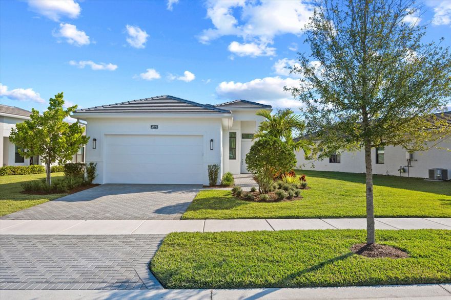 Beautifully furnished 3BR/2BA waterfront home with den in the desirable Cresswind Palm Beach community. This immaculate property offers an open-concept layout with upgraded tile, a stunning granite kitchen island, and a fully supplied kitchen. Living area includes a decorative fireplace, TV, and comfortable furnishings, plus a cozy dining space. The den provides an ideal office or flex room. The split-bedroom design includes one room with twin beds and another with a full bed and nightstands, serviced by a full bath. The carpeted master suite features a queen bed, TV, large walk-in closet, dual sinks, private water closet, and spacious walk-in shower with tile to the ceiling. Patio furniture included for enjoying serene waterfront views.
