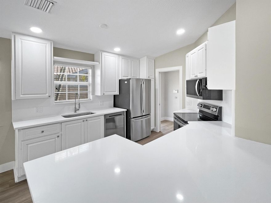 NEW ROOF - Discover relaxed Florida living in this beautifully updated 2BR/2BA Divosta Capri villa with private pool and pond view in The Retreat at Seabranch. A just completed new tile roof with dual underlayment offers long-term peace of mind, while modern updates bring a fresh coastal feel. Enjoy an open layout with high ceilings, new luxury vinyl plank flooring, quartz countertops, and soft designer tones. Poured concrete construction, full accordion shutters, and a screened lanai overlooking the pond add comfort and security. . Enjoy the clubhouse, resort-style pool, tennis, pickleball, fitness center, and walking paths. All just minutes from beaches, golf, and dining. Homes this turnkey in The Retreat rarely come available--schedule your showing early before it's gone!