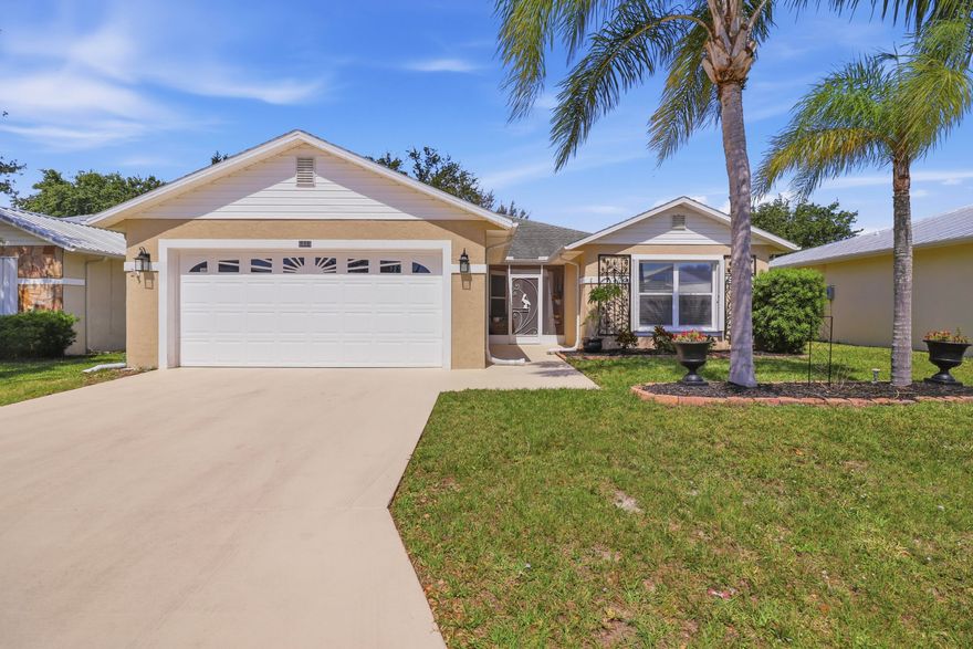 Welcome to Spanish Lakes Fairways, a desirable 55+ community in Fort Pierce offering an active lifestyle with golf, tennis, pickleball, shuffleboard, and more. This nicely updated 3 bedroom, 2 bathroom home with a 2 car garage is move in ready and offers comfortable indoor and outdoor living, plus a versatile Florida room that can be used as a 4th space, office, hobby room, or additional sitting area. Enjoy your morning coffee on the screened porch or relax on the brick paver patio out back. Accordion shutters provide added storm protection, and the land lease includes lawn care, trash, and access to the community amenities. A great opportunity to enjoy low maintenance living in a community with so much to offer.