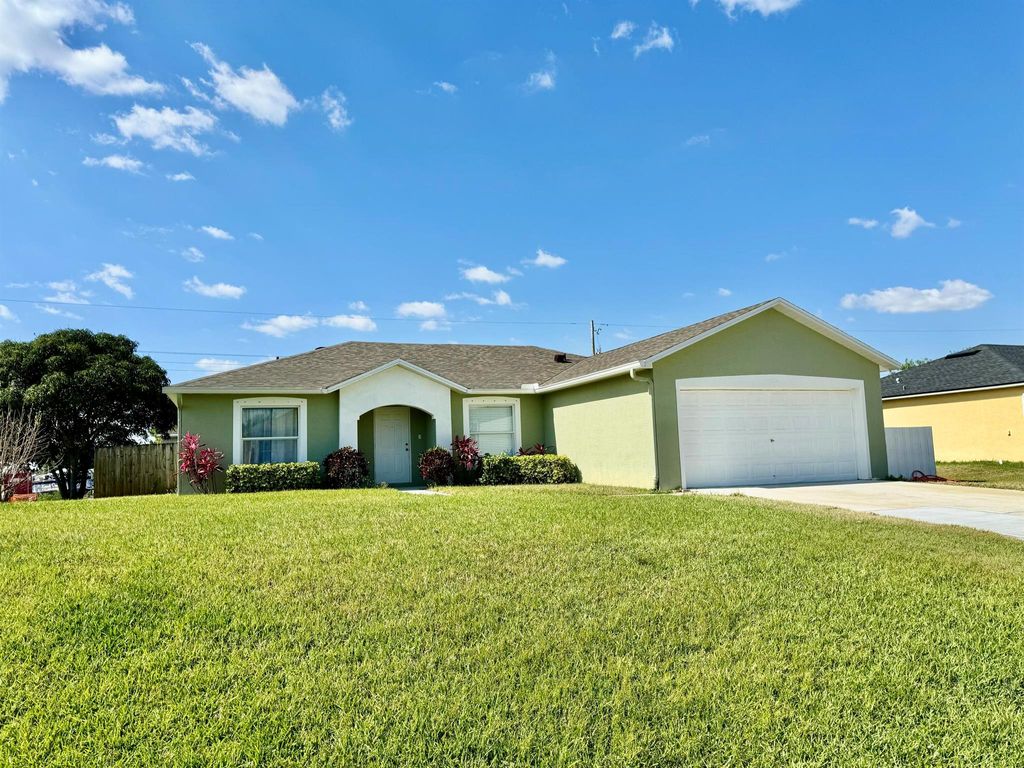 Photo of 452 SW Tarra Avenue, Port Saint Lucie, FL 34953 (MLS # R10981815)